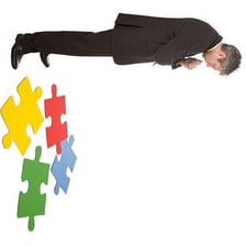 A person concentrating while solving a puzzle