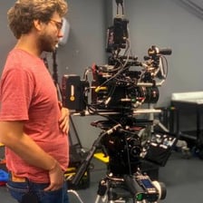 A compact camera being used to film a scene