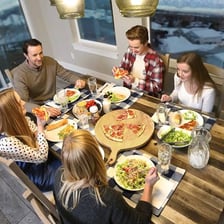 People beginning to eat a meal together