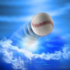 A baseball rising high into the sky after being hit.