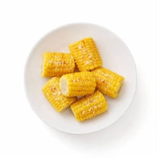 An ear of corn shown on its cob.