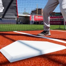 A baseball batter standing at home plate