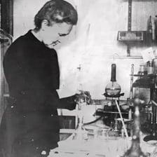 A historical portrait of scientist Marie Curie.