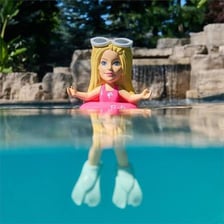 Illustration of an action figure resting at the bottom of a swimming pool