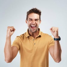 A person cheering with raised arms