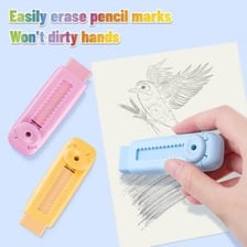 A hand using an eraser to remove pencil marks