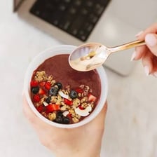 An acai bowl topped with an oat-based crunchy ingredient