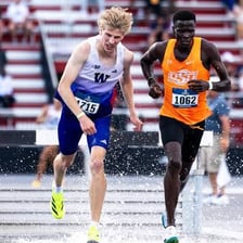 Two athletes competing closely for victory.