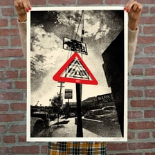 A warning sign instructing people to comply or face consequences
