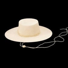 A light-colored, broad-brimmed straw Panama hat