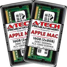 A computer memory module shown beside an Apple Mac computer.