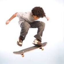 Skateboarder and board airborne during an ollie.