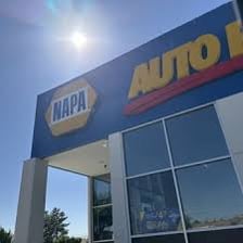 A visual pairing of a NAPA Auto Parts sign and a Napa Valley vineyard.