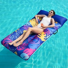 An inflatable raft floating on the surface of a swimming pool.