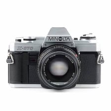A single-lens reflex film camera.
