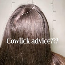 A person with a visible tuft of hair sticking up in a cowlick.