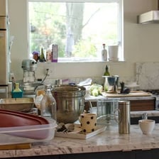 A kitchen sink containing dirty dishes