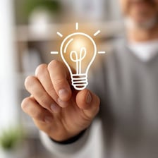 A glowing light bulb commonly used to represent an idea.