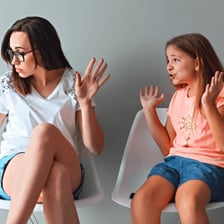 A child speaking defiantly to a parent.
