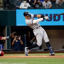 A baseball batter hitting a ball during a home run