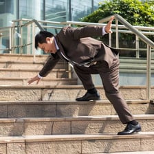 A person accidentally stepping incorrectly on a staircase