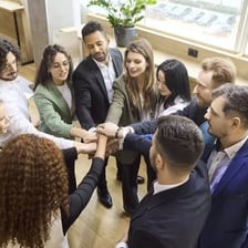 A person signaling agreement while joining a group