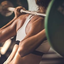 A person exercising to improve physical fitness
