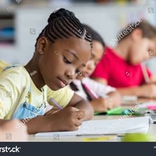 A student seated in a classroom.