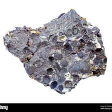 Rough rocks containing visible mineral ore.