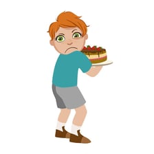 A child holding several toys and claiming them.