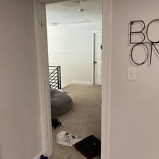 A person being escorted out of a room
