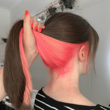 Hair being colored with dye