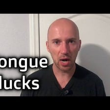 A person expressing disapproval with a tongue-clicking gesture