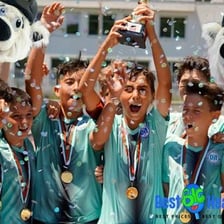 A sports team celebrating together with visible enthusiasm