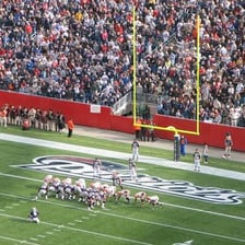 A football player attempting an extra-point kick