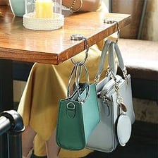 A small handbag or purse resting on a table