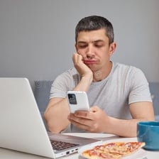 A person casually scrolling on a smartphone