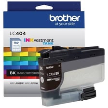 A printer ink cartridge beside a desktop printer.