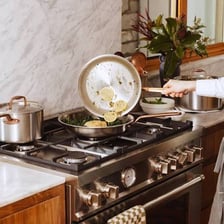 A cooking pan resting on a stovetop