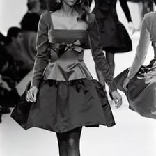 Tyra Banks walking a fashion runway.