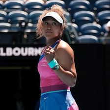 Naomi Osaka playing tennis at the Australian Open.