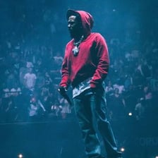 Kendrick Lamar performing on stage