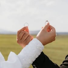 A couple exchanging rings during a wedding ceremony.