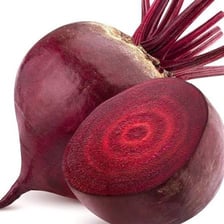 A freshly harvested red beet showing its round root
