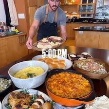 A person eating food from a grocery haul