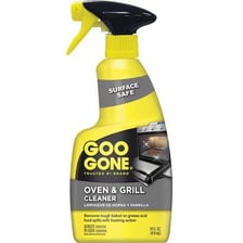 Oven cleaner being used on baked-on grease.