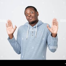 A person raising both hands in surrender