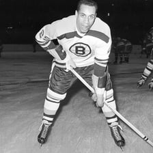 Willie O’Ree wearing a Boston Bruins hockey uniform.