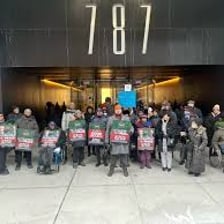 People holding signs in a peaceful picket protest