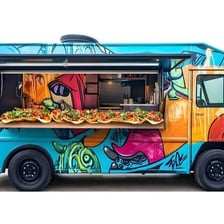 A colorful taco truck serving food on a city street